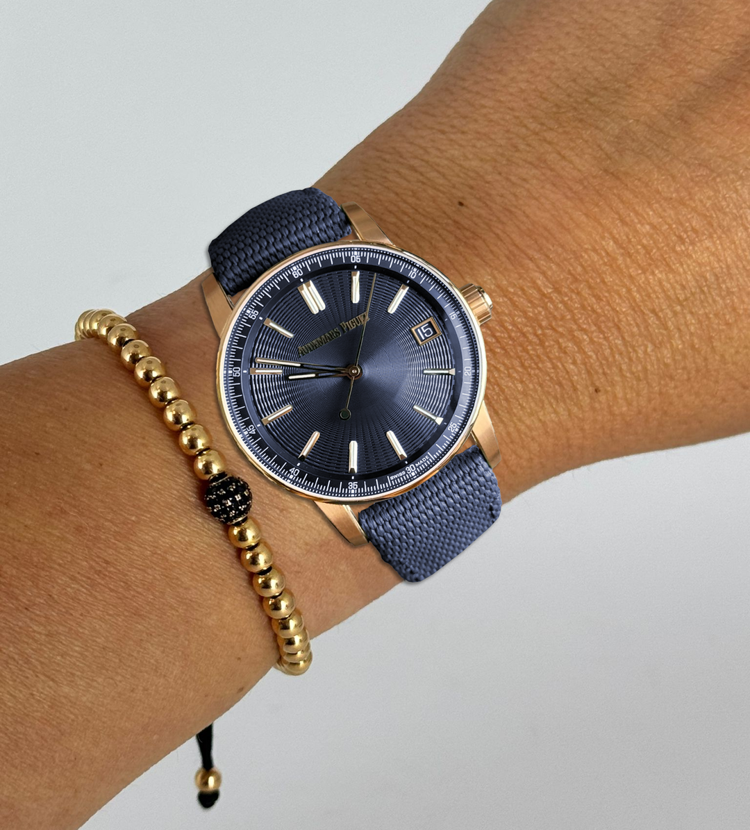 Code 11.59 Datum Automatikwerk, blaues Zifferblatt, Roségold