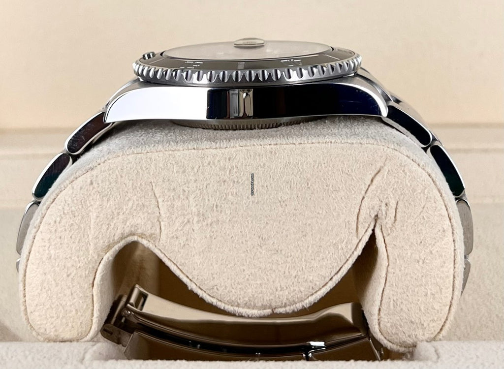 Submariner Date, wie neu, Box und Papiere